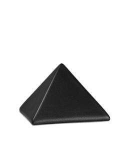 Schwarzes pyramidenförmiges Objekt auf einfachem, hellem Hintergrund. Aurora Tierkrematorium